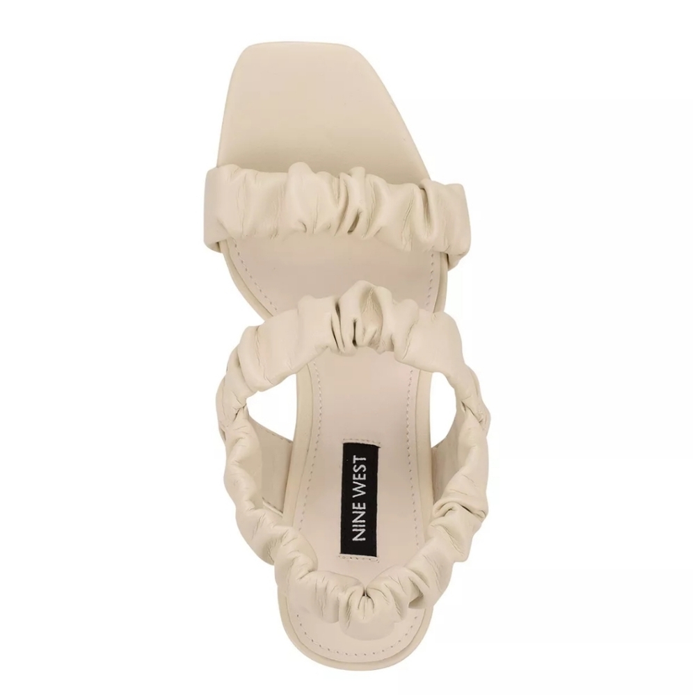 New.Nine West. Size  10 Dress Sandal. Looks more cream than white.